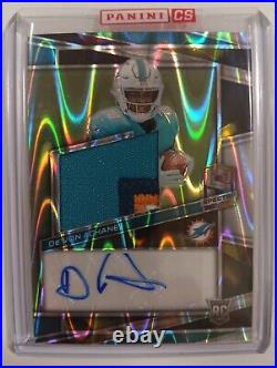 De'Von Achane Patch Auto 15/70 Spectra Supernova Silver Prizm 4-Color Jersey RPA